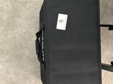 a suitcase that is sitting on the floor next to a chair