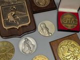 a lot of medals and other items on the table