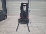 a picture of a forklift parked in a garage