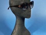 a mannequin head with a pair of sunglasses on it