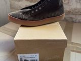 a box that has a pair of shoes on top of it