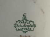 a close up of a plate with a picture of a man on it