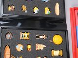 two boxes with different toys in them sitting on a table
