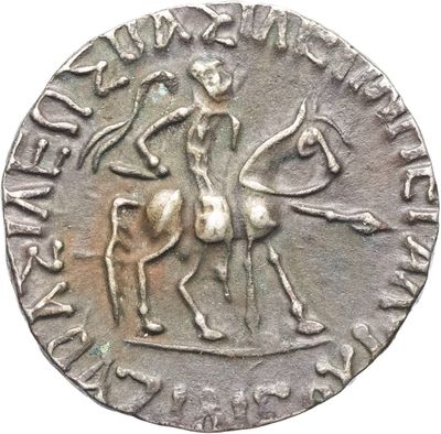 an old silver coin with a man on a horse and a woman on a horse