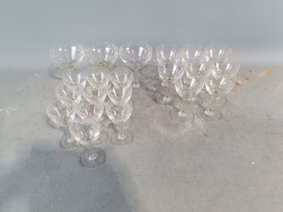 several empty wine glasses sitting on top of a table