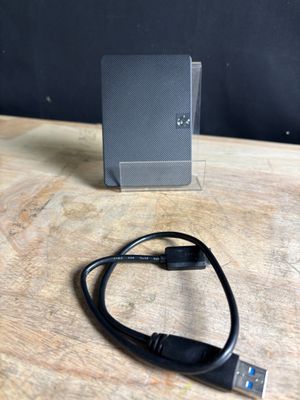 a usb cable connected to a hard drive on a table