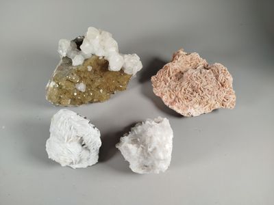 three different types of rocks on a table with a white background