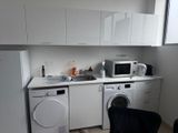 a kitchen with a washer and a dryer in it