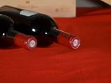 three bottles of wine sitting next to each other on a table