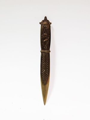 a close up of a knife on a white surface with a white background