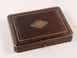a small wooden box with a decorative design on it