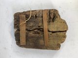 a piece of wood that has been wrapped in a string