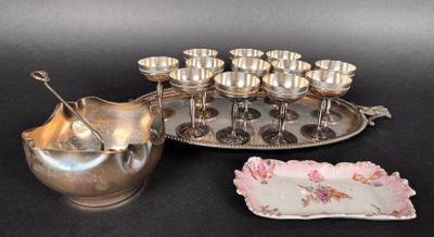 a silver plate with a pitcher and cups on it