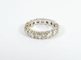 a close up of a diamond ring on a white surface
