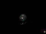 an image of a black oplite stone in the dark