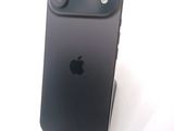 a black iphone that is sitting on a stand