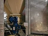 a picture of a machine that is working on a piece of metal