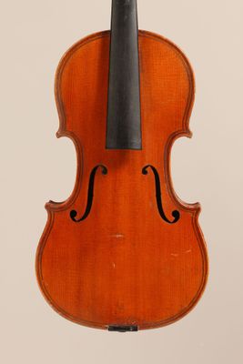 an old violin with a bow hanging from it ' s back