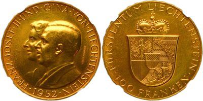 a close up of a gold coin with a picture of a man