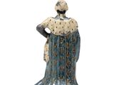 figurine of a woman in a blue dress with a crown on her head