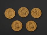 four gold coins with a picture of a castle on them