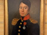 portrait d'un homme en uniforme militaire dans un cadre doré