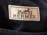 the label of a jacket with a horse and carriage on it