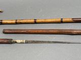 three different types of canes on a table next to each other