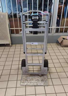 a small hand truck that is sitting on a tiled floor