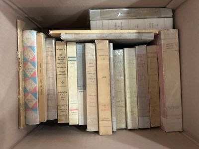 a box full of books that are sitting on a shelf