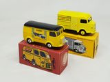 two toy trucks that are sitting next to each other