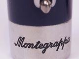 a close up of a silver and black lighter with the word monttegraps written on it
