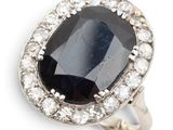 an image of a black and white diamond ring on a white background