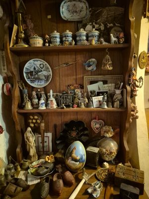 a wooden shelf with a lot of items on it
