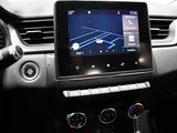the dashboard of a car with a tablet on the dashboard