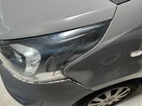 a picture of a damaged car in a garage