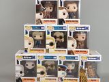 a stack of six pop vinyl figures of the doctor and his companions