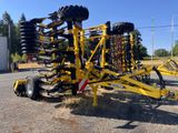 an image of a tractor mounted planter in the middle of a parking lot