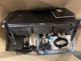 a computer in a box with a lot of wires on it