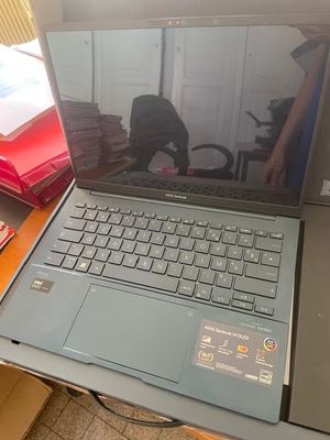 a laptop computer sitting on top of a desk