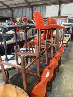 many chairs that are lined up in a warehouse