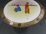 a plate with a picture of a man and a woman on it