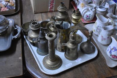 a tray with a lot of antique items on it