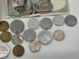 a lot of coins that are on the table next to each other