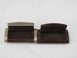 two small wooden boxes with metal handles on a white surface