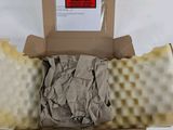 a cardboard box with a piece of paper inside of it