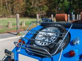 a blue car that is parked on the side of the road