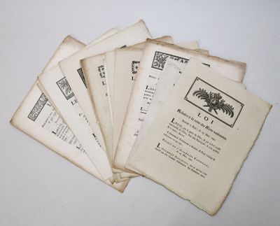 several old books are stacked on top of each other on a table