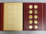 a box of gold coins sitting on top of a table