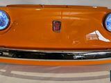 an orange car that is sitting on a table